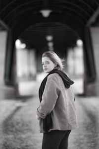 Portrait of woman standing outdoors