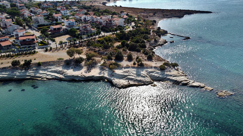 High angle view of sea and buildings in city