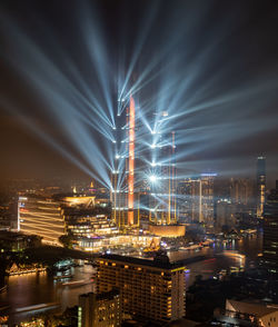 Illuminated buildings in city at night