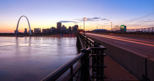 View of bridge over city at dusk