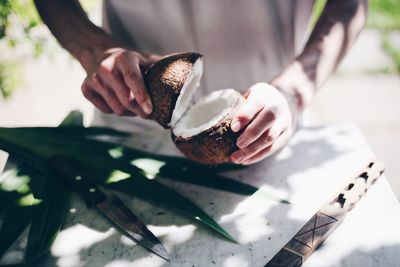 Midsection of person preparing food on table