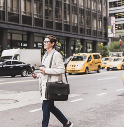 Usa, new york city, woman in manhattan on the go