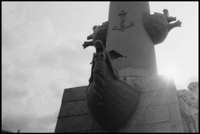 Low angle view of statue against sky