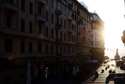 Street amidst buildings in city against sky
