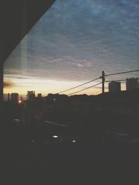 View of buildings against sky at sunset