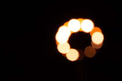 Defocused image of illuminated lights at night