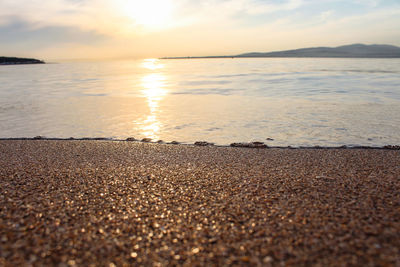 Scenic view of beach against sky during sunset