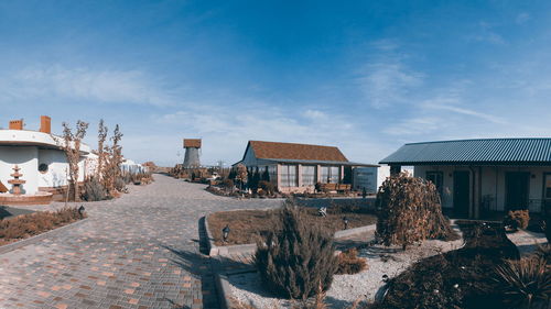 Houses and buildings against sky