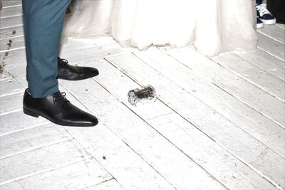 Low section of man working on footpath