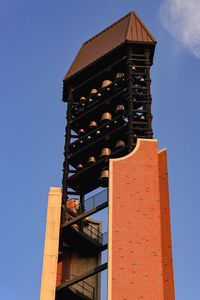 Low angle view of building against clear blue sky