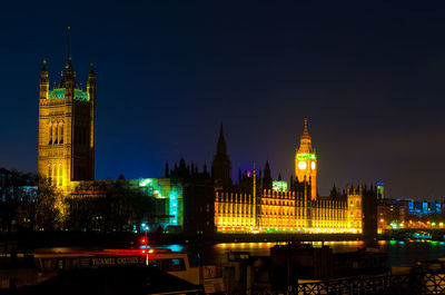 Illuminated buildings in city at night