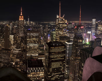 Illuminated buildings in city at night