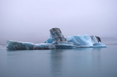 Scenic view of frozen lake against sky