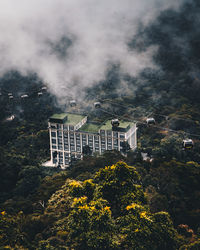 High angle view of trees and buildings against sky