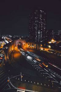 High angle view of illuminated city buildings at night