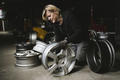 Female mechanic in car garage