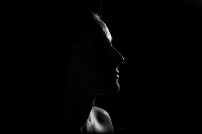 Close-up of woman in darkroom