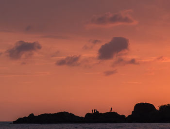 Scenic view of sea against orange sky