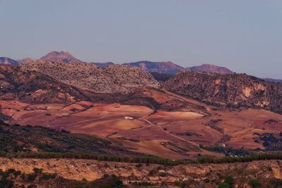 Scenic view of arid landscape against clear sky