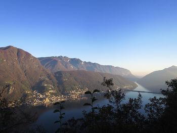 Scenic view of mountains against clear blue sky