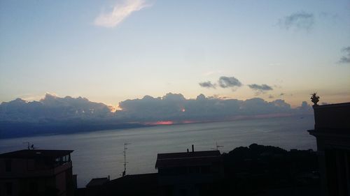 Scenic view of silhouette mountains against sky at sunset