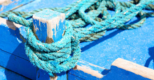 High angle view of ropes tied on wood