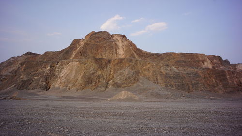 Rock formations in desert against sky