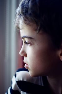 Close-up portrait of boy looking away