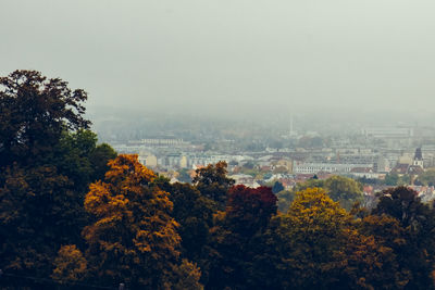High angle view of trees and buildings against sky