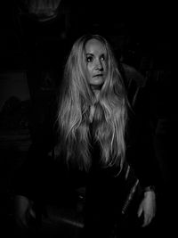 Young woman sitting at home