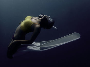 Side view of man swimming in sea