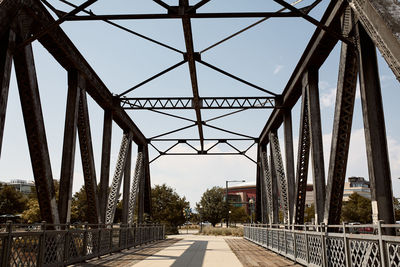 Looking through pedestrian bridge on cherry creek trail in downtown denver, colorado, usa