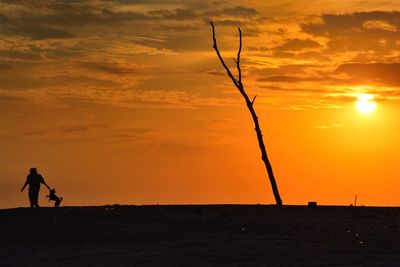 Silhouette of people at sunset