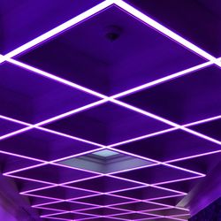 Low angle view of illuminated ceiling lights