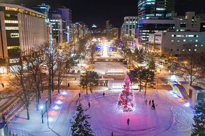 Aerial view of illuminated city at night