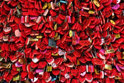 Full frame shot of red colored locks on a fence of romeo and juliet