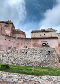 Old ruin building against cloudy sky