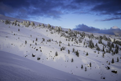 Scenic view of mountains against sky during winter