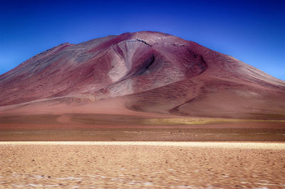 Scenic view of desert against clear sky