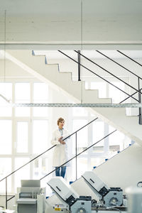 Woman working on staircase