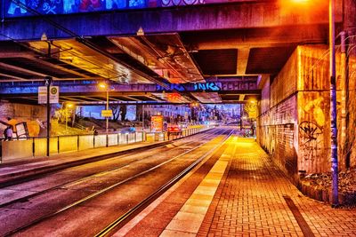 Illuminated railroad station at night