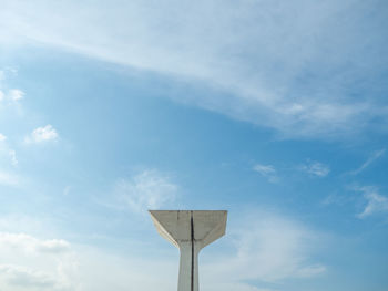 Low angle view of street light against building