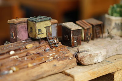 Close-up of model houses on wooden table