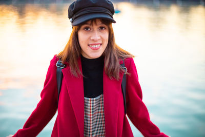 Portrait of smiling young woman in lake