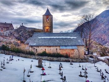 View of clock tower on snow covered landscape