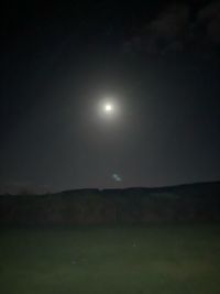 Scenic view of field against sky at night