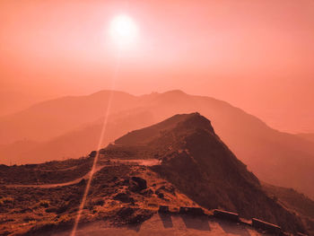 Scenic view of mountains against sky during sunset