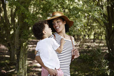 Mother with son in forest