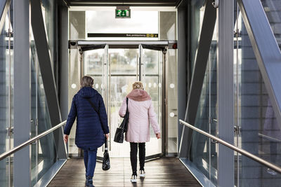Senior women walking at train station