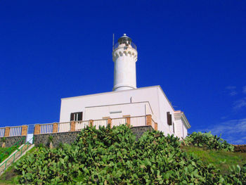 Lighthouse against blue sky